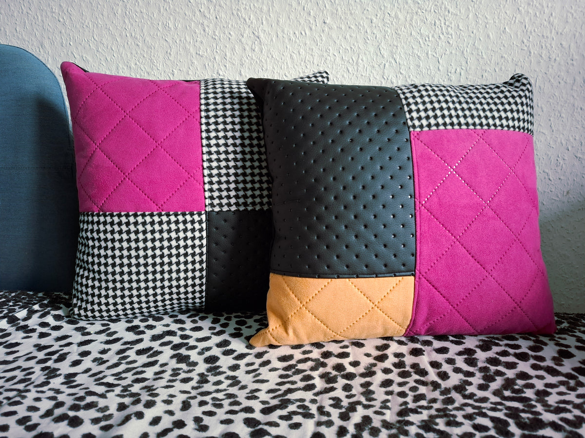 Zwei Patchwork-Dekokissen mit Magenta-Wildleder, Gelbem Wildleder, Hahnentritt-Muster und perforiertem schwarzem Kunstleder