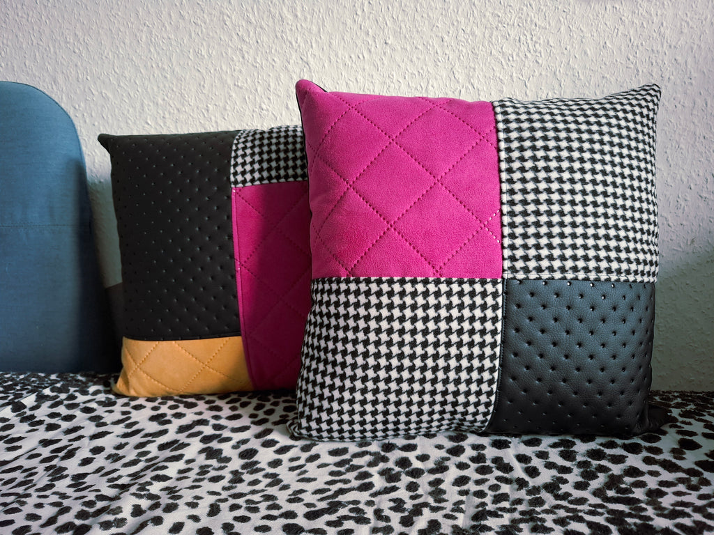 Zwei Patchwork-Dekokissen mit Magenta-Wildleder, Gelbem Wildleder, Hahnentritt-Muster und perforiertem schwarzem Kunstleder